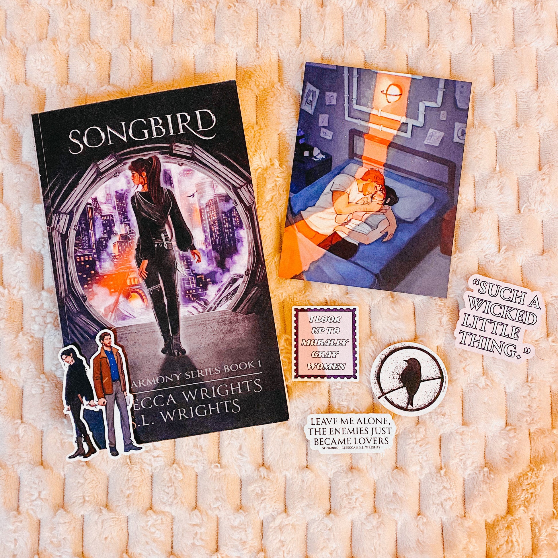 Photo of Songbird by Rebecca Wrights plus four stickers, artwork, and a couple sticker