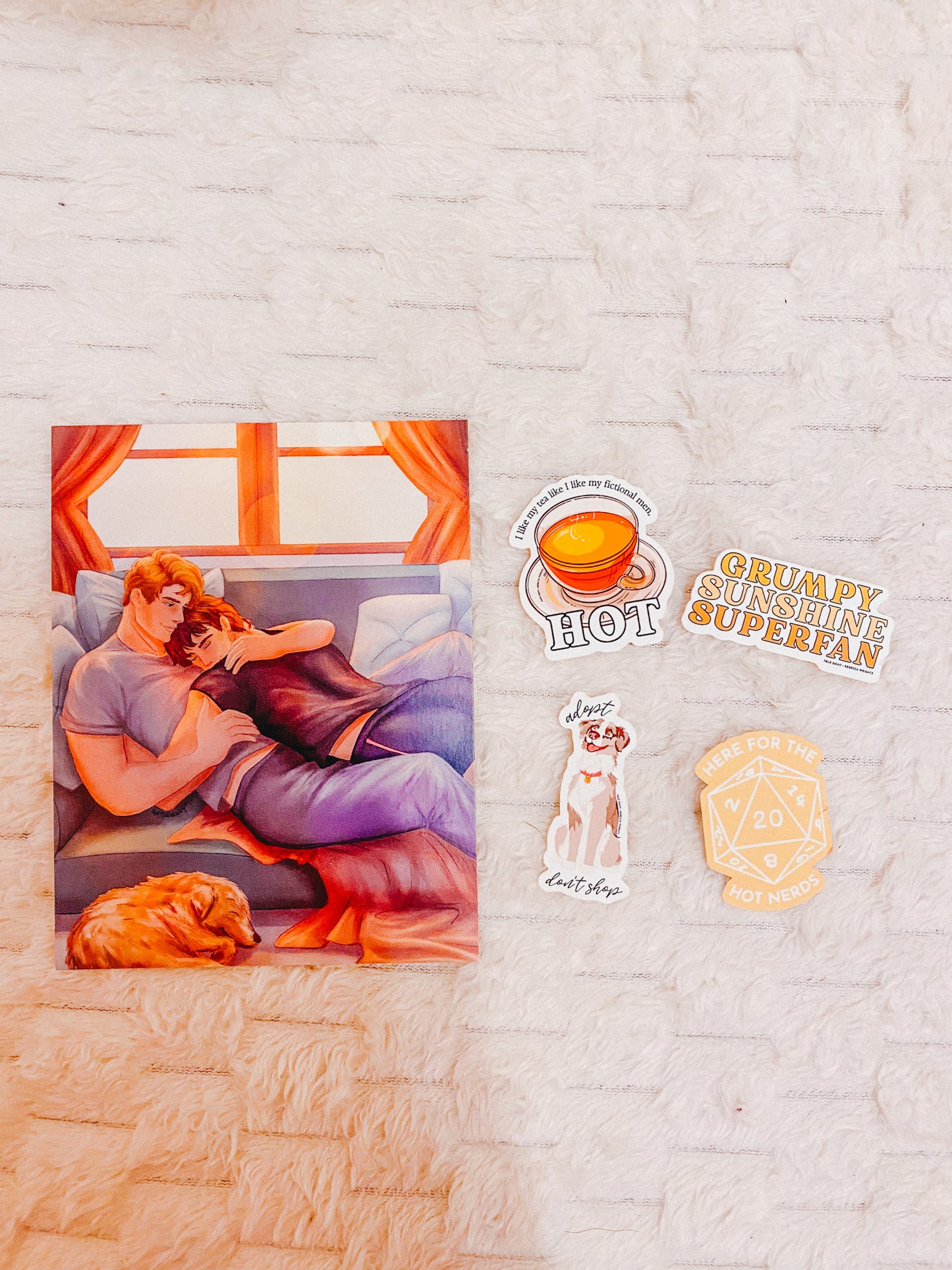 Sticker with a couple on a couch, 'Hot' coffee cup, 'Grumpy Sunshine Superfan' text, and a dog illustration on a textured surface.